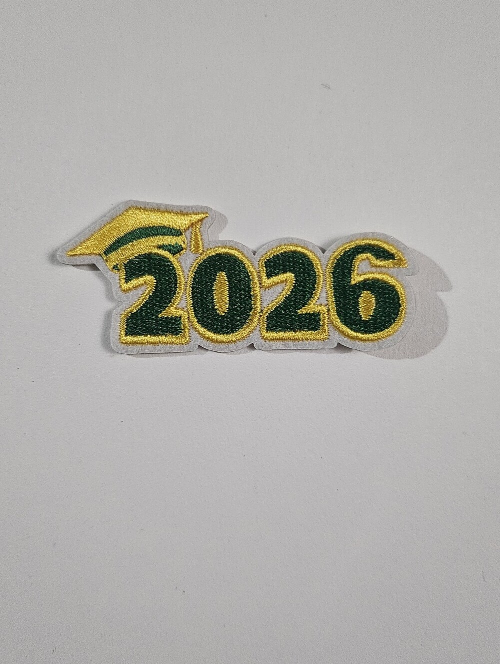 2026 iron-on patch, new without tags, green and yellow